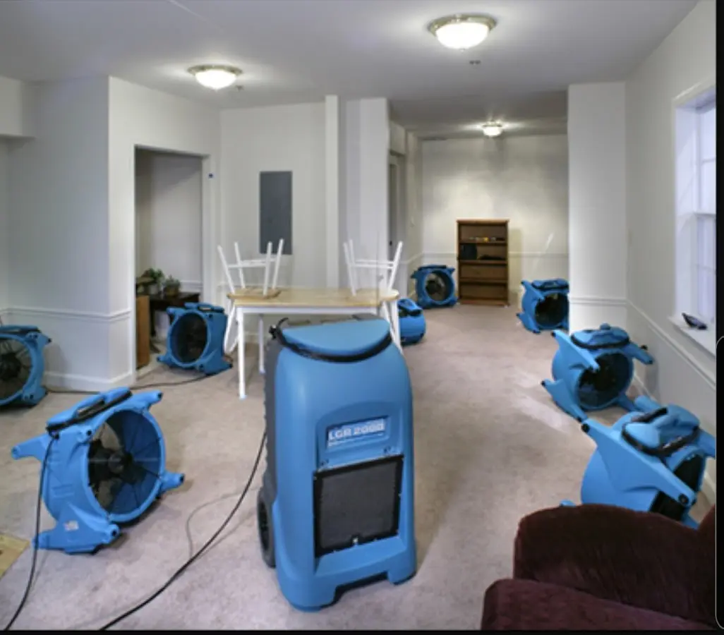 Air movers and dehumidifier setup for Water Damage Restoration in Keene